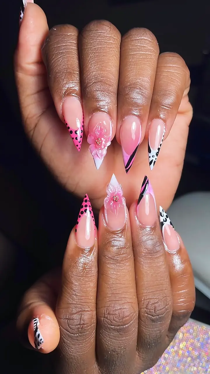 Long stiletto nails with pink French tips, flowers and animal-print accents
